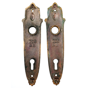 The backs of each escutcheon, showing the stamps