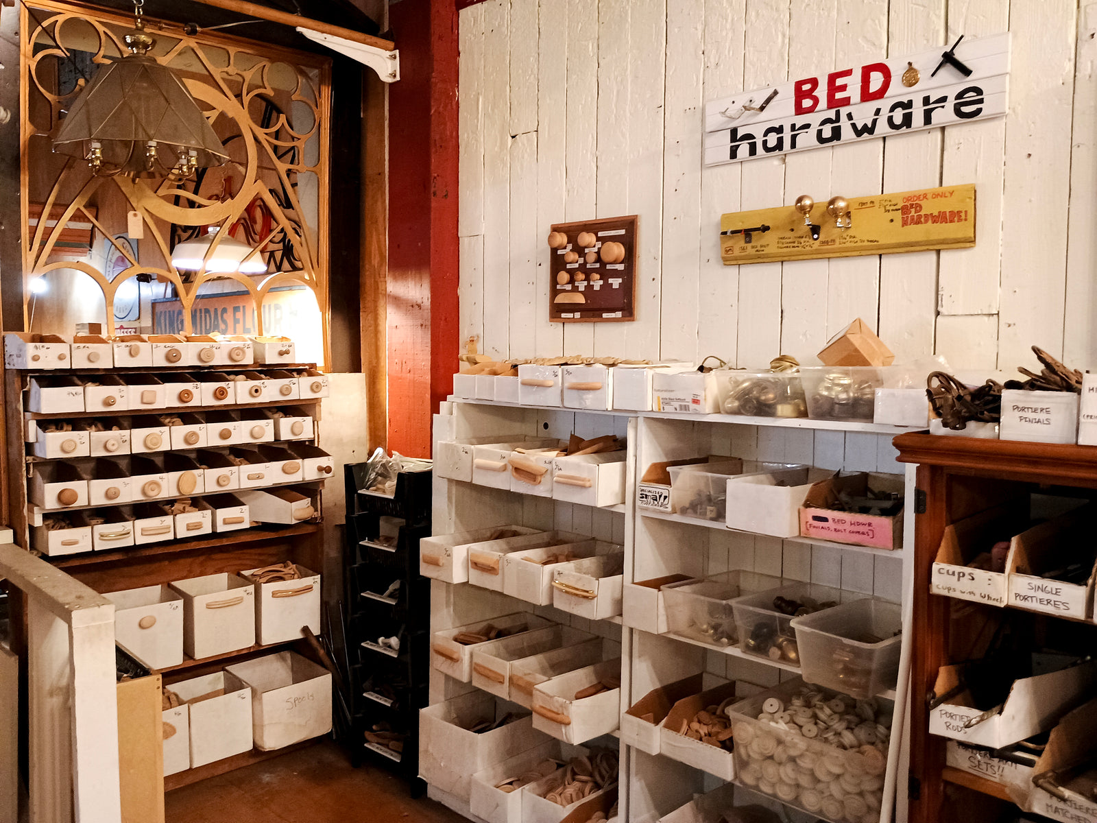 A corner display labeled "BED HARDWARE" as well as a display containing a variety of wooden knobs
