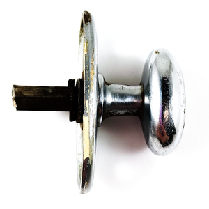 The knob, showing some surface wear on the base and some shallow scratching on the knob itself, as well as a clearer look at the shortened spindle