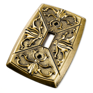 An angled view of the switch plate, showing the brushed brass edge