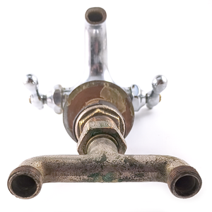 The water supply ends of an antique mixer faucet