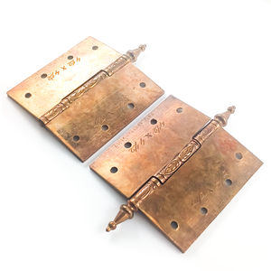 An angled view of the backs, highlighting the still-brassy finish