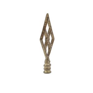 A vintage brass finial in the shape of four diamonds, forming a larger overall diamond shape