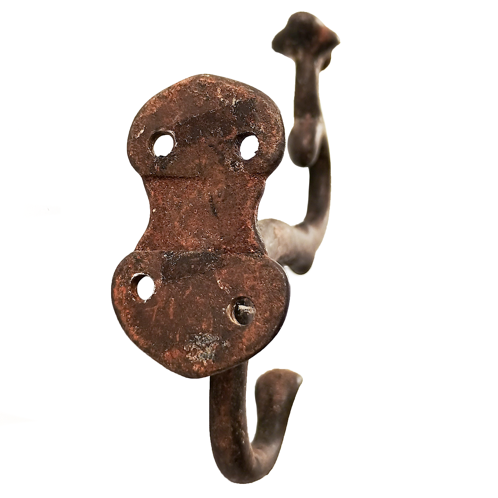 A uniquely-shaped antique iron double coat hook facing to the right, with an odd crest shape on top of the upper hook