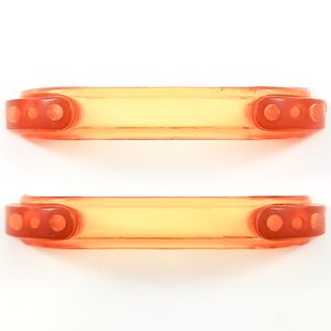 Two bright orange translucent Bakelite drawer handles, with darker orange sections at each end