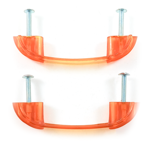 Two bright orange translucent Bakelite drawer handles, each with two screws sticking out of the ends