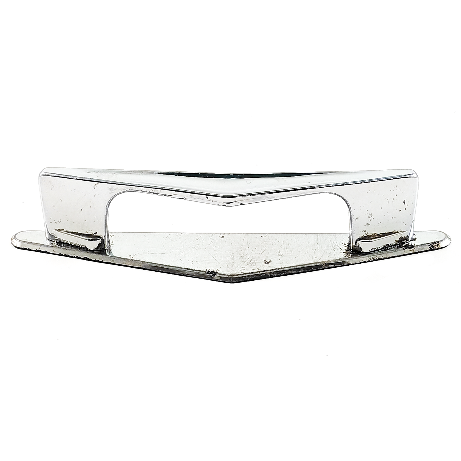 A single chevron-shaped chrome-plated drawer handle on a chrome-plated triangular back plate