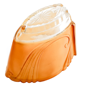 An orange glass slip shade with scrolling designs along the side, as well as a clear portion with a starburst design pressed into it