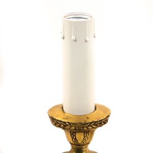 The upper portion of an Art Nouveau table lamp, shaped like a brass candlestick complete with faux candle