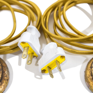 The vintage-styled cords and plugs for a pair of Art Nouveau brass table lamps