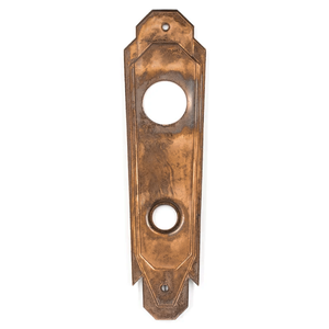 The back of a bronze Art Deco escutcheon
