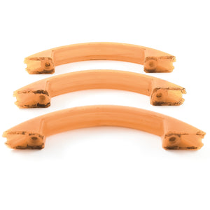 The backs of the handles, showing significant dark staining on the mounting surfaces. The handles are slightly translucent at this angle.