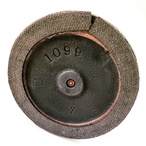 The base of a vintage Dietzgen Sharpoint lead pointer, with stamps reading "1099" "D" and "7"