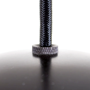 A close-up of the black braided cord cover of a pendant lamp