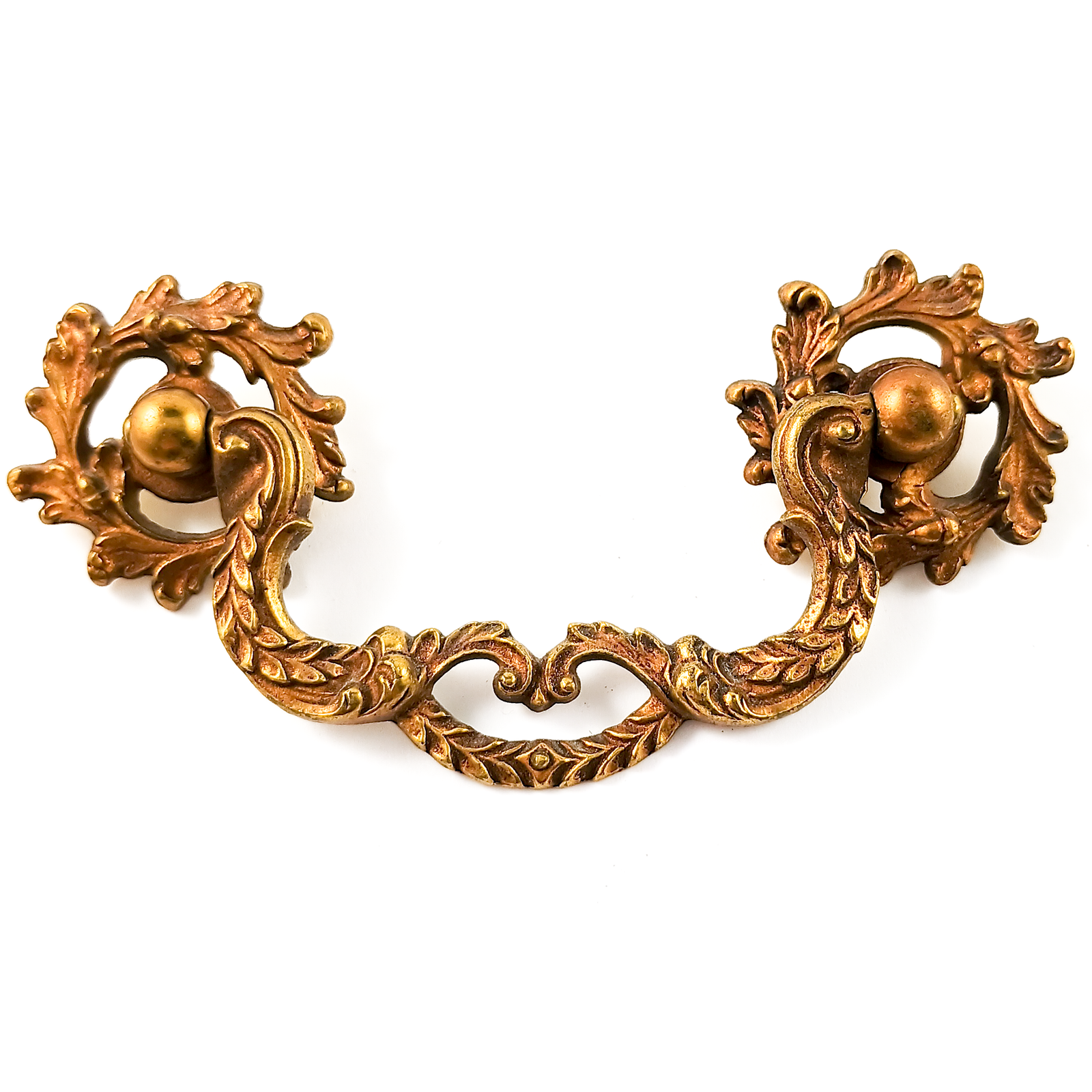 A single brass drawer handle consisting of two round mounting pieces and a handle in the middle held up by them. The mounting pieces are open acanthus leaf scroll work, and the center  piece has two curved pieces decorated with leaves, which meet in the middle and have a second curved piece below the center creating an open shape