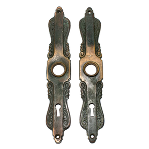 Two bronze Art Nouveau escutcheons with significant patina and ornate designs