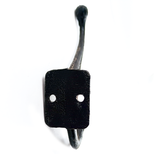 The base of the black coat hook, which is rectangular with two screw holes