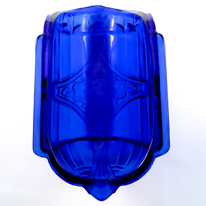 The interior of a cobalt blue glass slip shade, showing a smooth pressed rim and fitting