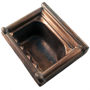 An angled view of a wall-mounted porcelain soap dish, showing the shiny metallic copper glaze and the interior of the soap dish