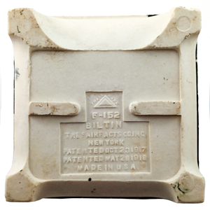The back of a tile-in porcelain soap dish, featuring a large stamp reading "F-152 BILTIN - THE FAIRFACTS CO INC NEW YORK - PATENTED OCT. 23 1917 PATENTED MAY 28 1918 - MADE IN USA"