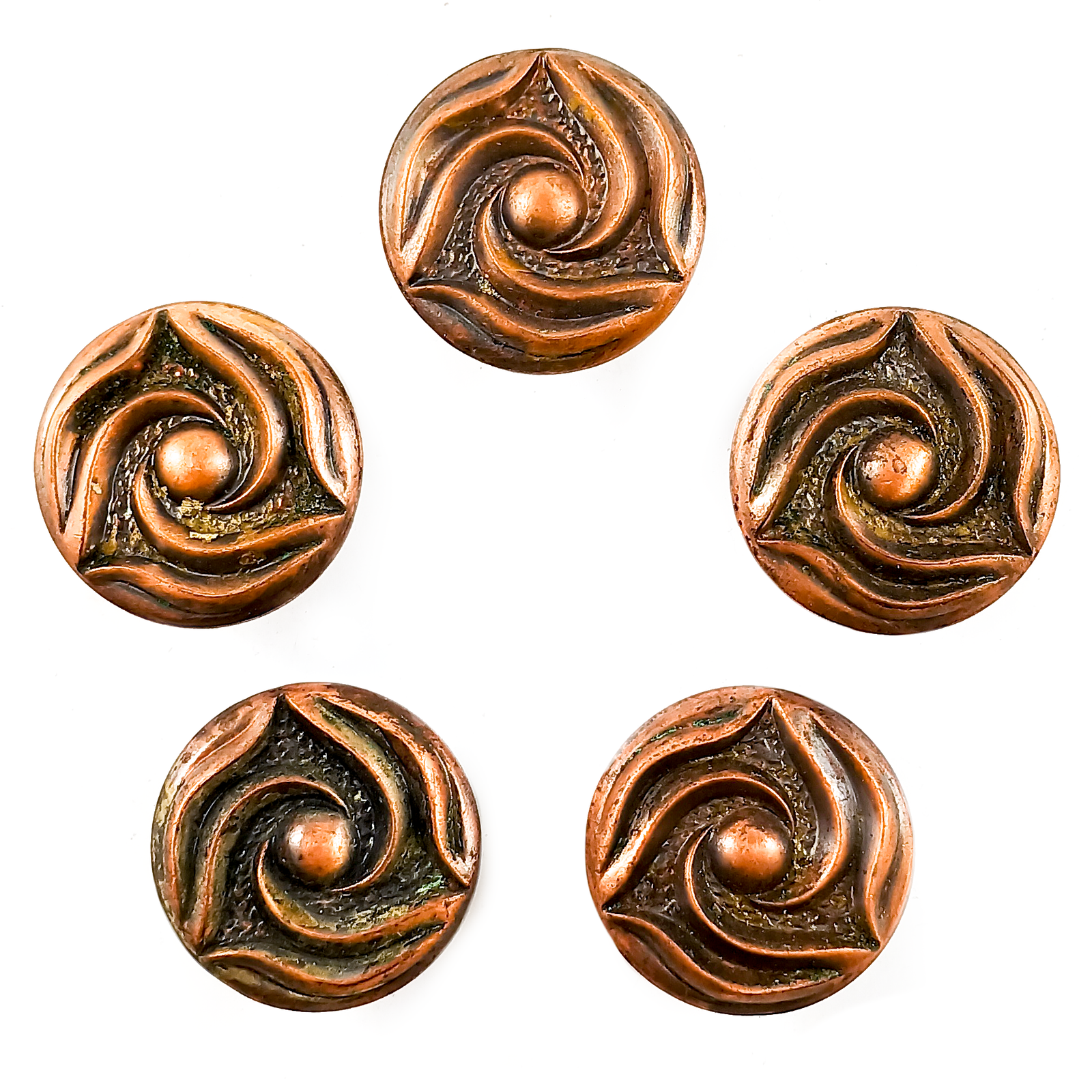 Five round copper cabinet knobs with three-pointed swirl designs, arranged in a circle