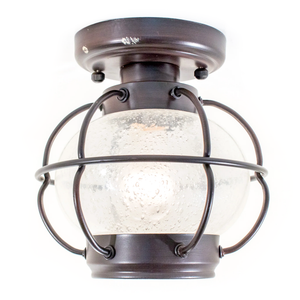 An industrial-style ceiling-mounted light fixture shaped like a lantern, with dark bronze-finished metal and bubbly clear glass
