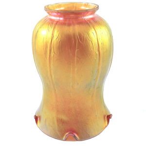 An iridescent golden tulip-shaped glass lamp shade, showing a hand-ground flared fitter and areas of green and pink iridescence