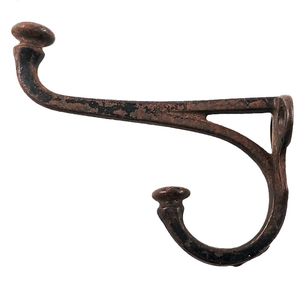 A cast iron double coat hook with acorn ends, some surface rust, and some remaining black enamel coating