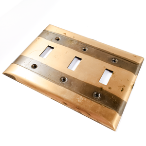 An angled photo of the lighter plate, showing some of the surface staining/residue