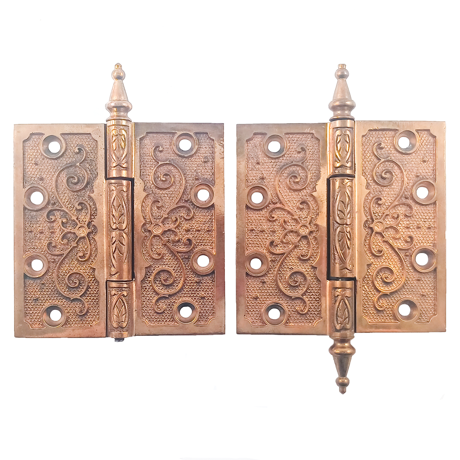 Two pairs of ornate brass hinges, one of which is missing a finial. The brass finish shows very little wear or patina.