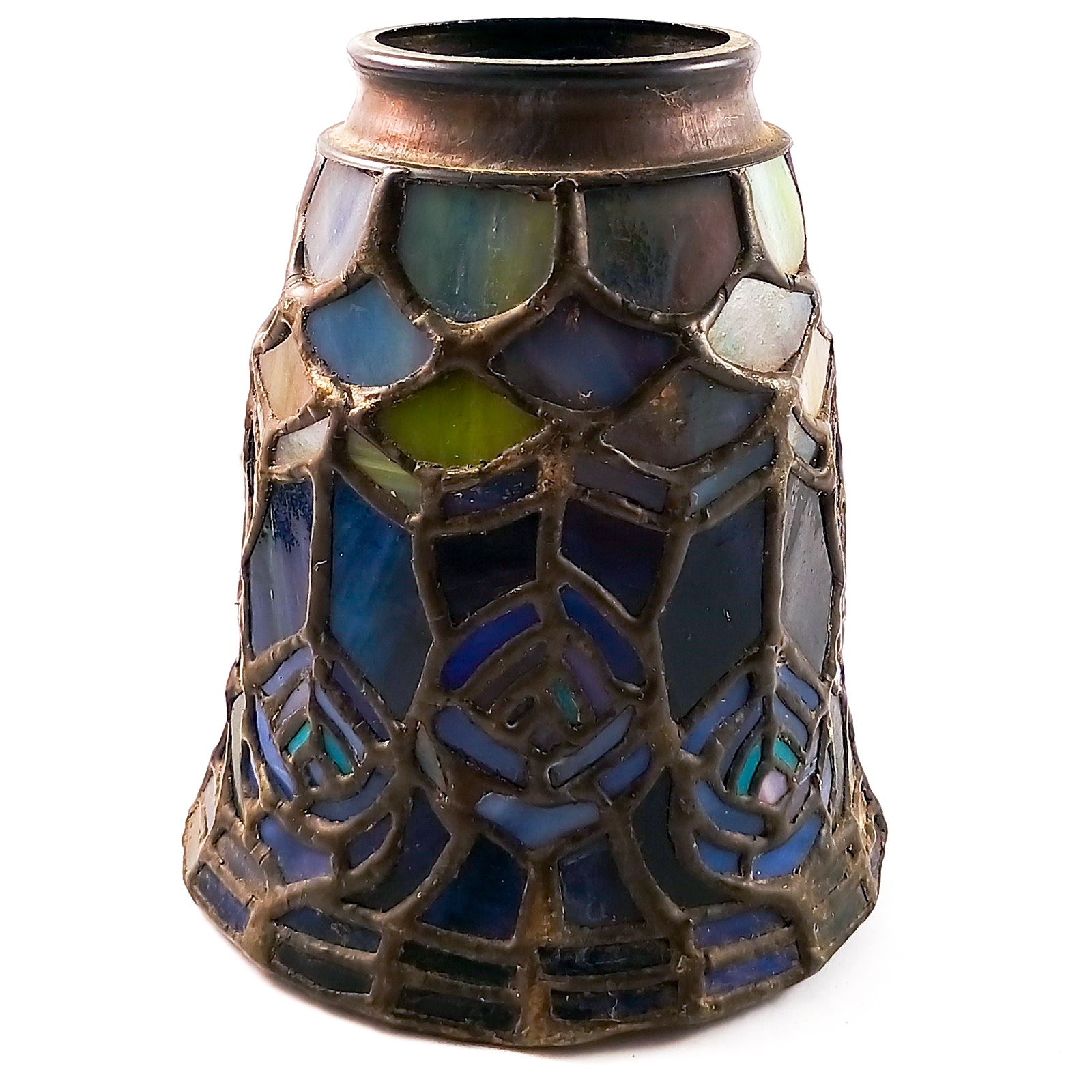 A stained glass lamp shade pointed downward, with a pattern resembling peacock feathers in shades of blue, aqua, and pink, with a scaled pattern at the base which appears green, blue, and purple, and a dark bronze finished fitter
