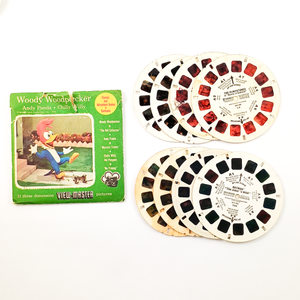 Lot C - Other Media. A "Woody Woodpecker" set, with a slightly torn sleeve, and four loose reels arranged in two fanned-out stacks. "The Flintstones in 'Beasts of Bedrock'" and "Batman 'The Joker's Wild!'" are visible