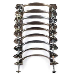 Nine nickel-plated vintage drawer handles with mounting screws lined up in a row, showing the underside of each handle