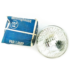 A Westinghouse par lamp next to its original packaging, a blue box with the Westinghouse logo on it