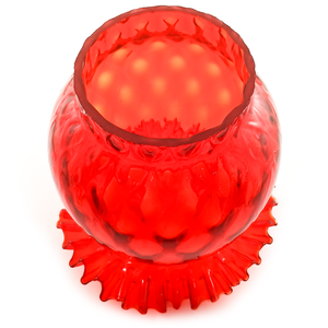 The fitter of a bright red glass lamp shade with a ruffled edge