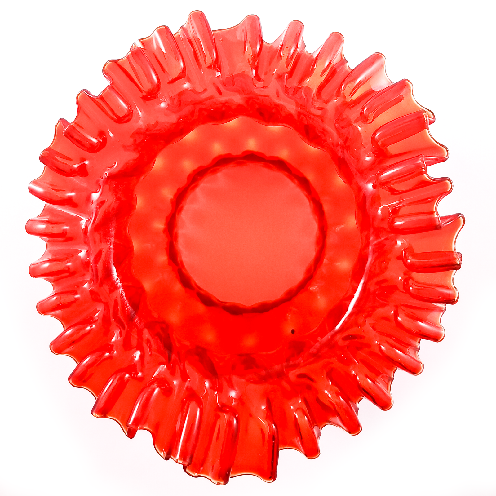 A red bell-shaped lamp shade with a hand-crimped ruffled edge and a textured body, sitting on its fitter
