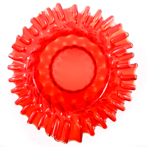 A top-down view of the ruffled edge of a bright red glass lamp shade