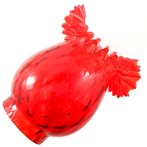 A side view of a bright red lamp shade with a decorative ruffled edge