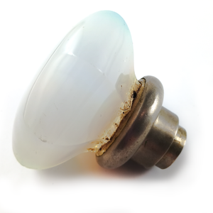 A side view of the knob and base, showing some of the discolored glue at the base of the knob