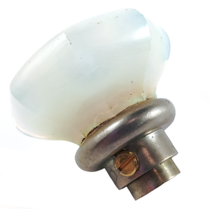 A photo of the base of the knob, showing the set screw and some of the dings in the glass