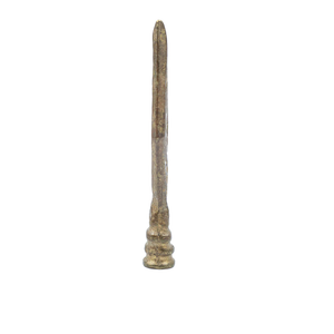 A side view of a vintage brass finial