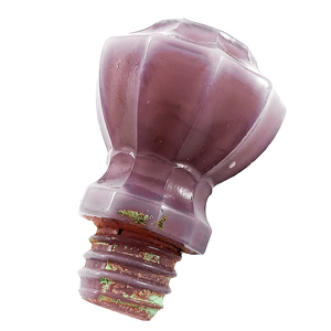 A side view of the knob, showing the glass looking almost white and milky at the edges, and some light green paint in the threads and on the base of the knob