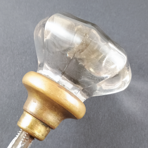 A close-up of one of the glass knobs, showing some minor surface dings