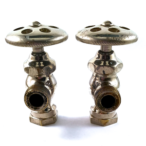 Two nickel-plated angle stops seen from the front. They have wide, flat knobs with decorative holes in them, and a fair amount of visible wear and scratches, particularly around the openings.