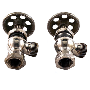 The undersides of two nickel-plated right angle stops, showing the decorative holes in the knobs and a fair amount of surface wear