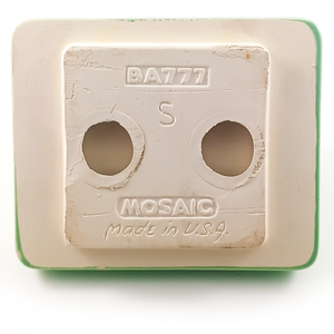 The unglazed back of the toilet paper holder, with the brand stamps, the model number "BA777" and the letter S