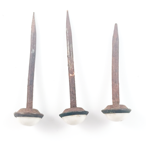 Another top-down view of the nails, showing the screw threads and a small amount of non-rusted metal