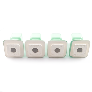 The undersides and unglazed backs of all four towel rack ends, showing that the stamps match, though some are more faded than others