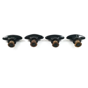 An angled view of the pulls, showing the undersides of each one. Two are slightly chipped right at the base.