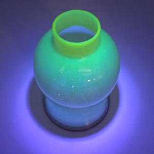 The fitter under UV light, fluorescing brightly